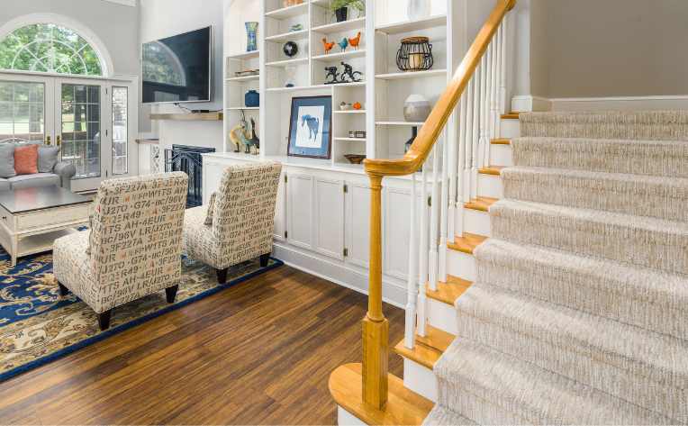 central staircase with patterned treads in home